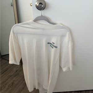 The Inconvenience Store Graphic Tee - Cream with Green Logo